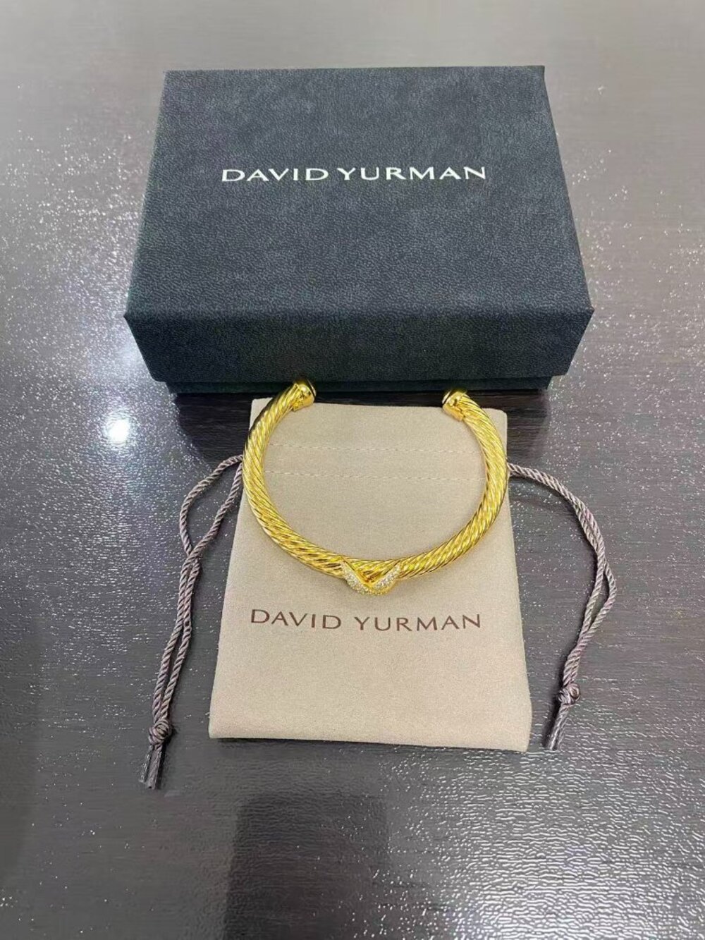 David Yurman's bracelet with a cross motif